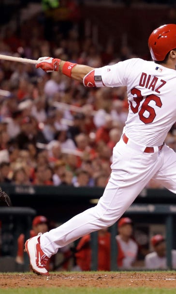 Cards power past emotions, bounce back against Reds